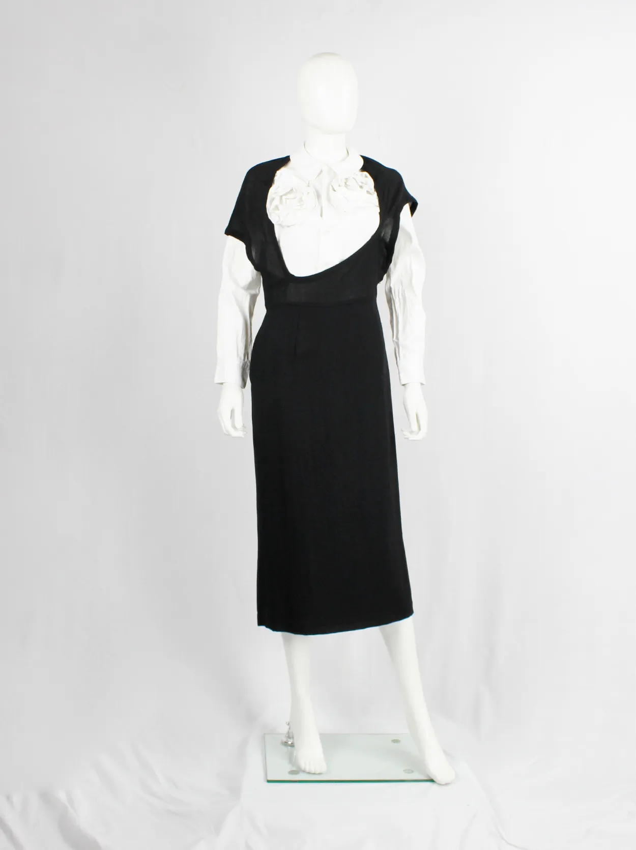 Comme des Garçons black dress with deformed upper and extra low neckline — spring 1999