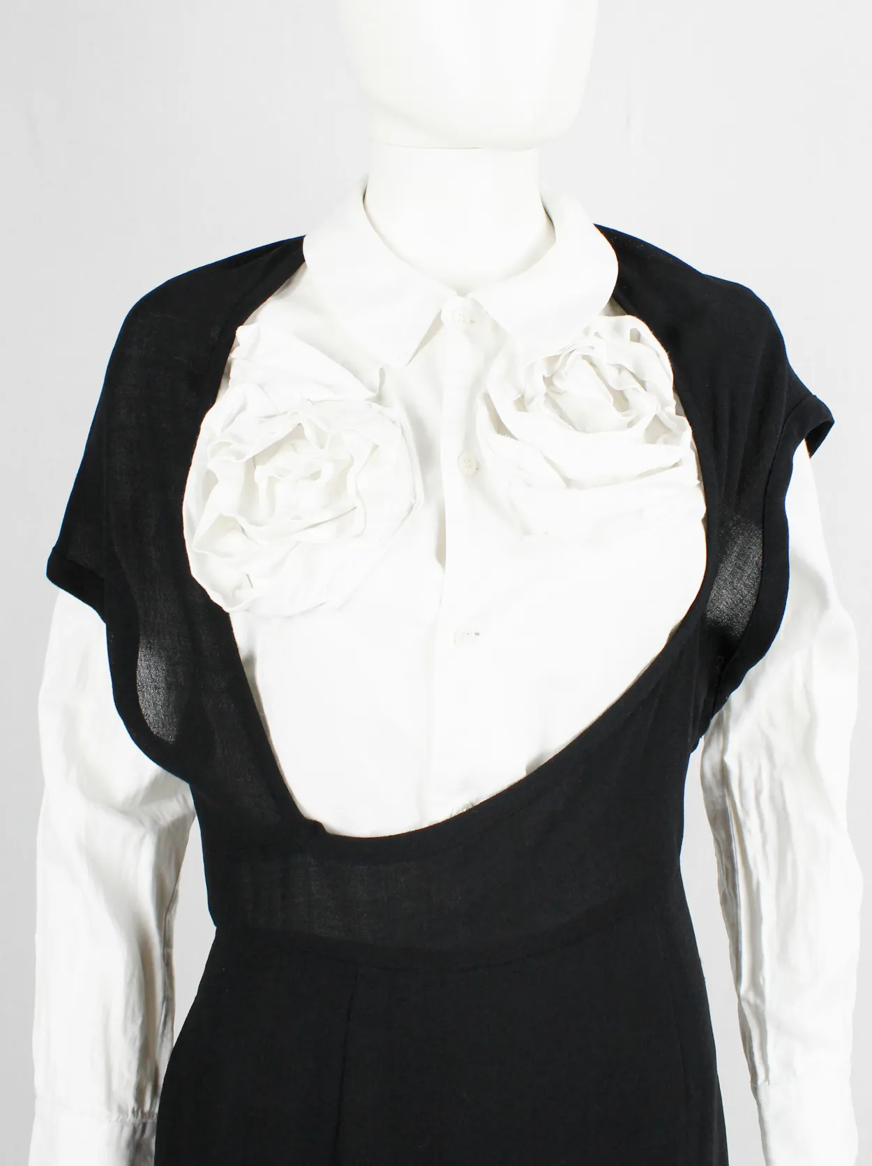 Comme des Garçons black dress with deformed upper and extra low neckline — spring 1999