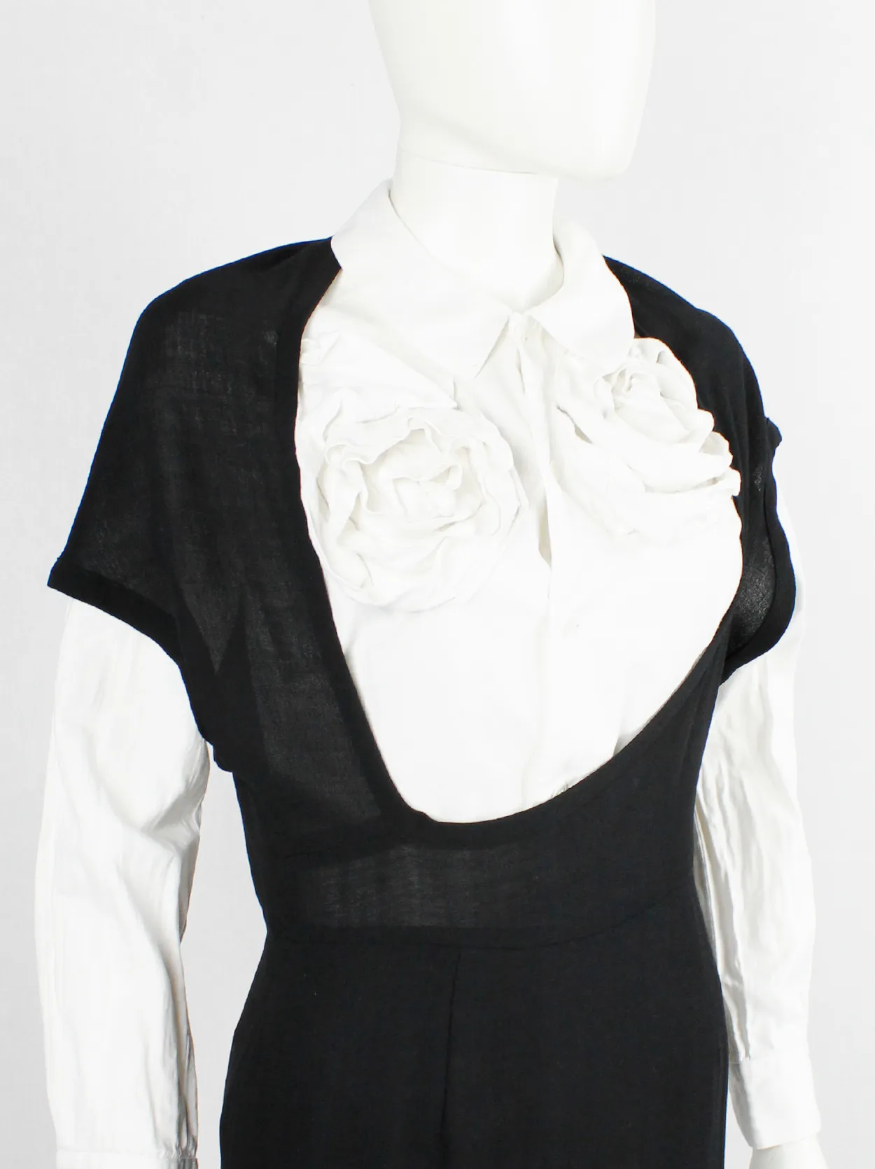 Comme des Garçons black dress with deformed upper and extra low neckline — spring 1999